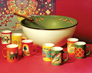 A collection of dining ware featuring Peter Max art.