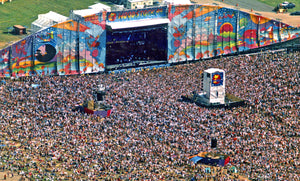 Birds eye view of the stage at Woodstock 1999 and the large crowd watching the show.