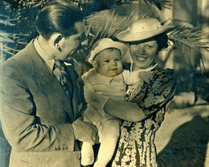 Peter Max as an infant being held by his parents in 1937.